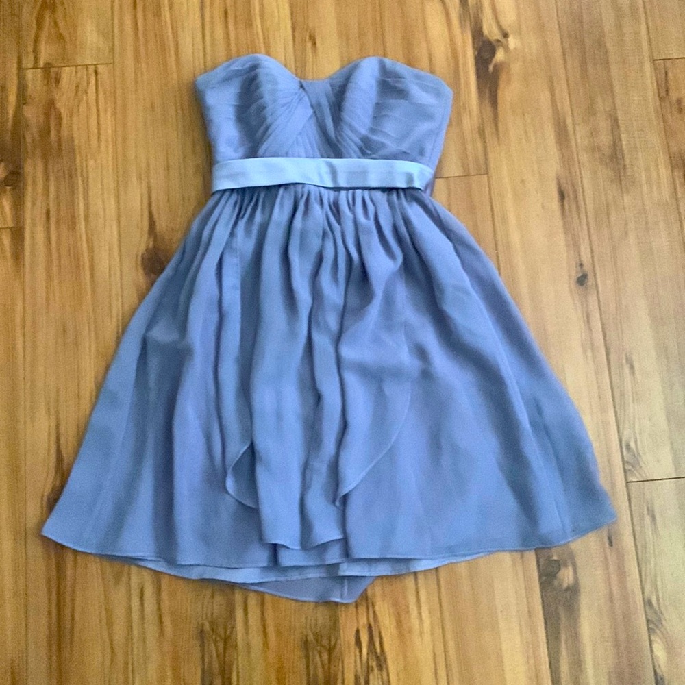 lavender dress with ruffle details.